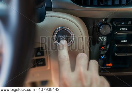 The Man's Finger Pressing The Start Button. Using The Push Button To Start And Stop Engine. The Driv