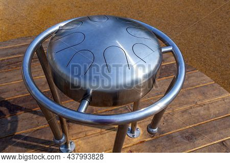 Hang Pan Drum Outdoors In Public Place. Zen-like Modern Trendy Musical Instrument. Fimbo And Glucoph