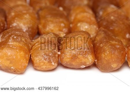 Close up shot of South Indian sweets called Khaja on white plate
