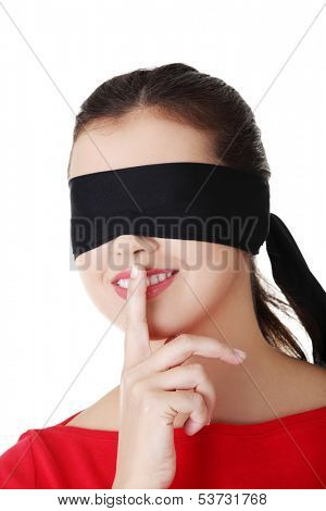 Attractive cheerful girl with band on eyes. Isolated on white. 