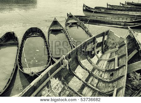 Old fishing boats stranded on the Jurilovca shore, near Danube Delta 