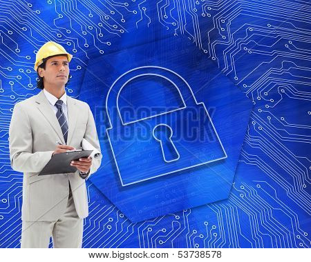 Composite image of attractive architect taking notes