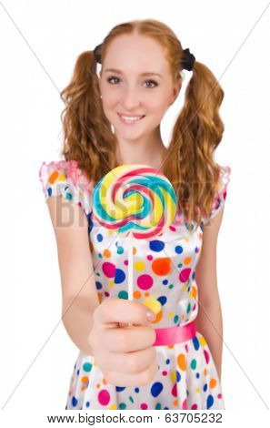 Redhead young girl with lolipops isolated on white