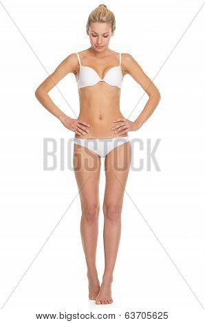 Full Length Portrait Of Young Woman In Lingerie