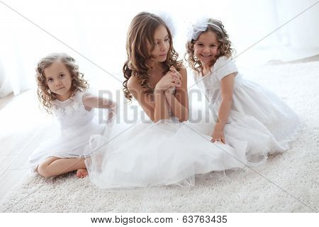 Beautiful little children wearing flower girl dresses