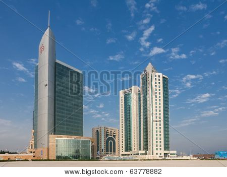 DOHA, QATAR - NOVEMBER 18, 2007: The commercial district of Doha with a sparse scattering of new-built towers in the early stages of the Gulf Emirate's building boom.