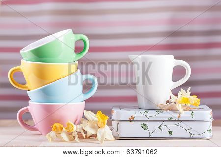 Colored Cups With A Pitcher And Daffodils Vintage Retro