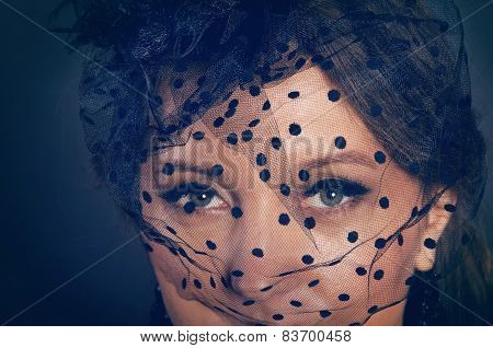 Woman Wearing A Hat With Black Veil With Dots