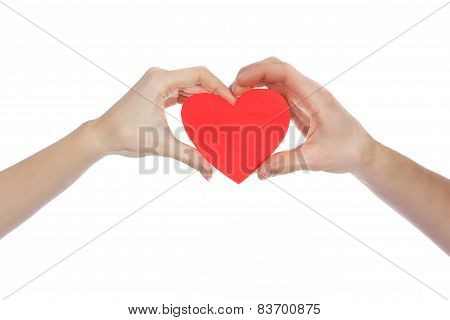 Couple in love holding a red paper heart in their hands isolated on white Background