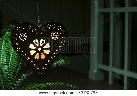 Heart Shape And Light From A Candle