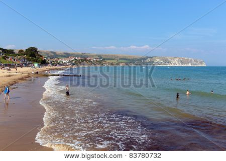 Sunshine and warm weather brought bathers to Swanage beach Dorset coast