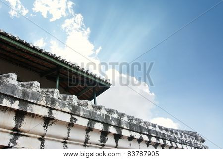 white old wall of asian temple on hill