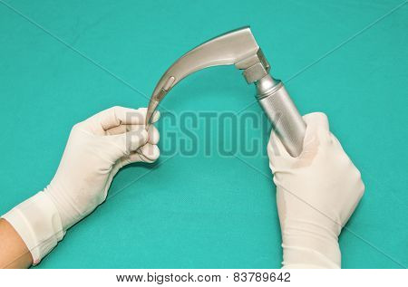 Laryngoscope In Hand Of Doctor