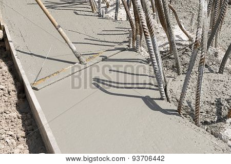 Construction worker smoothing concrete with copy space for your text.
