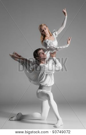 Two young ballet dancers practicing. attractive dancing performers  in white