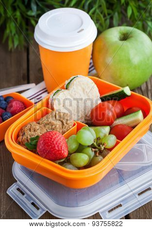 Lunch Box With Sandwich, Cookies, Veggies And Fruits