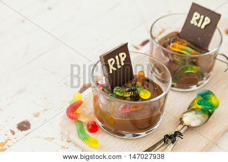 Chocolate mousse with gelly worm with halloween decorations