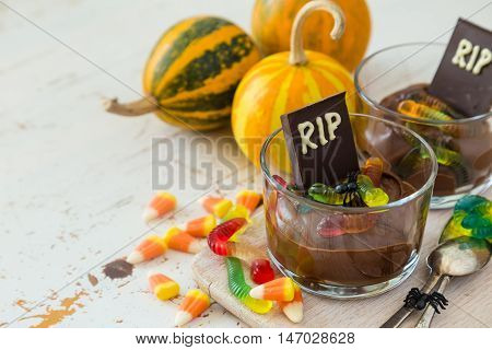 Chocolate mousse with gelly worm with halloween decorations