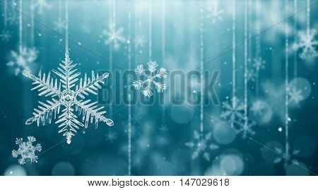Macro snowflake and fallen defocused snowflakes on blue background - 3D Rendering