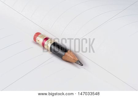 Black Pencil With Pink Eraser On A Paper