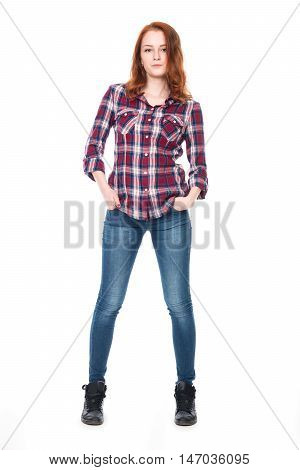 Young pretty curly woman in plaid shirt and jeans posing. Beautiful girl in full-length isolated on white background