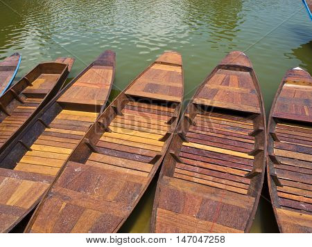 Inline Wooden boat float on waer / in lake