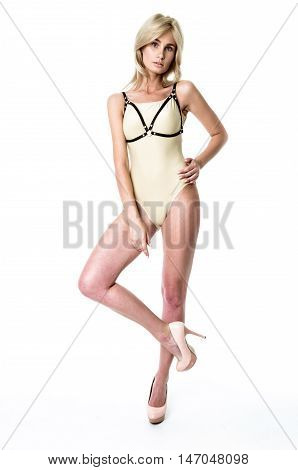 Blonde girl wearing bodysuit and black leather belt