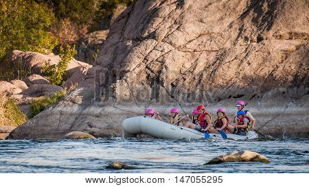 Village Myhiya Nikolaev region Ukraine - September 10 2016: Rafting on the Southern Bug River. An experienced instructor holds the key to a great adventure. Rafting in Ukraine. Fun, risky, bold action.