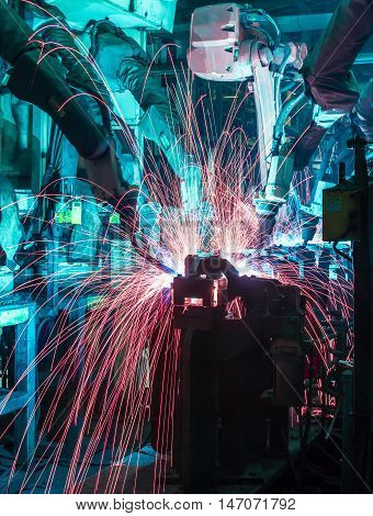 Welding robots movement in a car factory