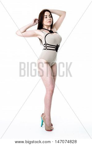 Brunette girl wearing bodysuit and black leather belt