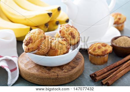 Banana muffins with cinnamon and streusel on breakfast table