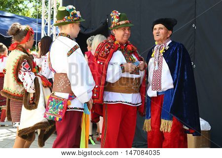 4 September 2016. Rakhiv Transcarpathian region Ukraine. Festival Hutsul brynza . People dressed in national costumes. Folklore ensemble. Elderly man sings