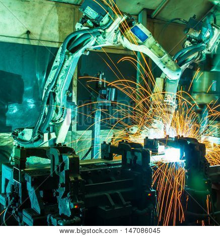 Welding robots movement in a car factory