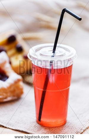 Fresh Compote Of Dried Fruits In Plastic Cups On Rustic Table Wi