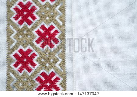 Fragment of hand embroidery on canvas. Background.