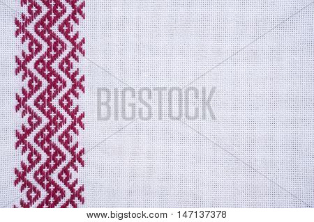 Fragment of hand embroidery on canvas. Background.
