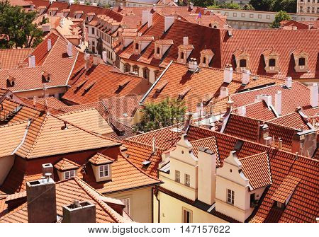 Houses with traditional red roofs in Prague Old Town Square in the Czech Republic 