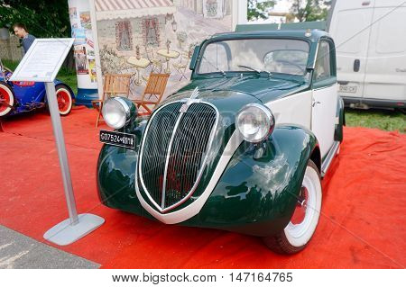 Kharkiv Ukraine - May 22 2016: Retro car green Fiat Topolino manufactured between 1936 and 1955 is presented at the festival of vintage cars Kharkiv Retro Rally - 2016 in Kharkiv Ukraine on May 22 2016
