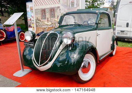Kharkiv Ukraine - May 22 2016: Retro car green Fiat Topolino manufactured between 1936 and 1955 is presented at the festival of vintage cars Kharkiv Retro Rally - 2016 in Kharkiv Ukraine on May 22 2016