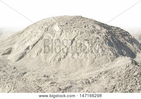 sunny illuminated light brown heap of earth in gradient white back