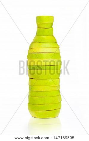 Bottle made from green sliced apples on white