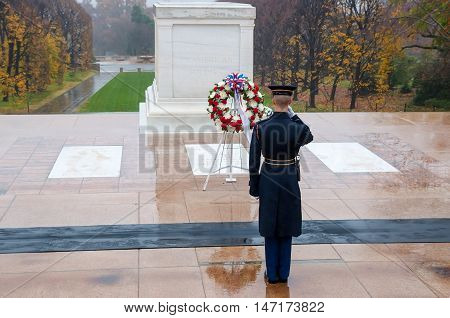 Arlington USA - November 16 2011: Soldier salutes - changing the guard in the afternoon at the grave of the unknown soldier at the cemetery of Arlington in Washington USA
