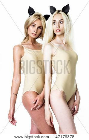 Blonde girls wearing bodysuits and black mouse ears