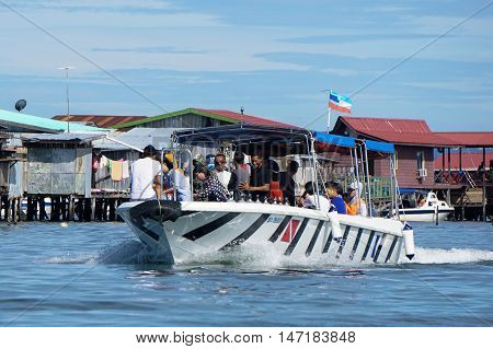 Semporna,Sabah-Sept 10,2016:Speedboat with tourists at Semporna,Sabah on 10th Sept 2016.Semporna town is a gateway for diving & snorkeling trips to the islands of Sipadan,Mabul,Mataking,Maiga & others