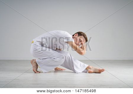 Man practicing capoeira , brazilian martial art.