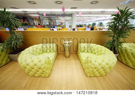 MOSCOW - JUN 03, 2015: Leather couches in rest zone of office. Tinkoff Credit Systems is first Russian bank that has completely refused from branch of bank