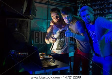 RUSSIA, MOSCOW - 21 DEC, 2015: Three Djs (with model releases) are standing together at Rublev club.