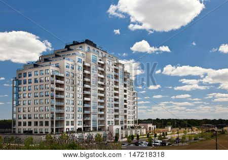 Modern residential high rise building subdivision neighbourhood blue sky perspective view
