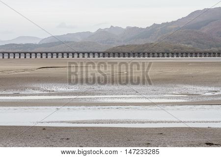 Estuary and railway viaduct. Mawddach Estuary Fairbourne Wales United Kingdom