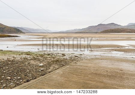 Estuary and railway viaduct. Mawddach Estuary Fairbourne Wales United Kingdom
